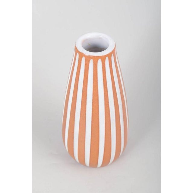 Ingrid Atterberg for Upsala-Ekeby, Vase Elegant teardrop-shaped vase in glazed earthenware, adorned with vertical white...