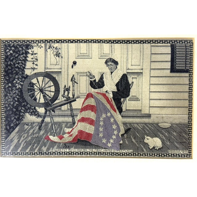 Likely English made, ca.1900, silk. Showing an image of Betsy Ross sewing an American Flag, all black & white accept the...