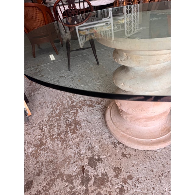 Fantastic 1970s plaster pedestal dining table in the style of Michael Taylor. Features a sculptural stacked-form pedestal...