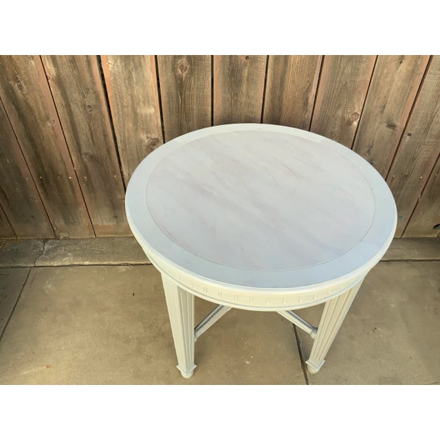 Modern unique foyer/accent table with weathered white stain/finish. The table has a country French look and feel with a...