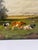 An unsigned 19th-century pastoral oil on canvas, probably English, depicting cattle and sheep at rest within an open rural...