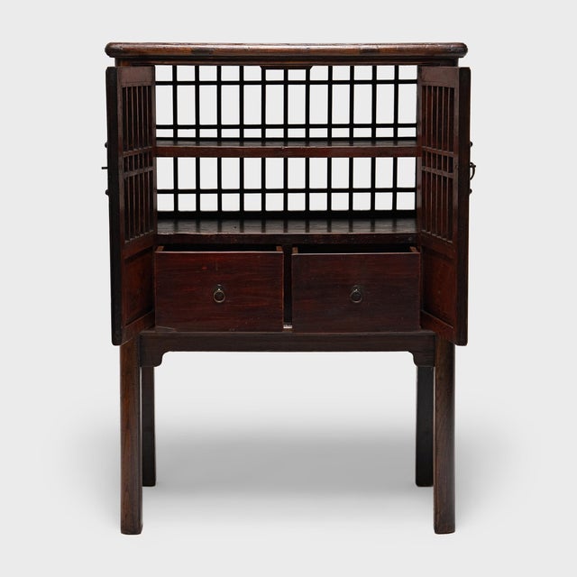 This 19th century kitchen cabinet is known as a catbox, named for its original use in keeping cats, dogs and other...