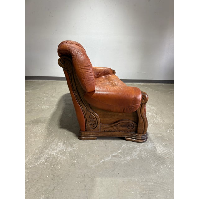 Elegant European design in this sofa set. Likely Dutch or German, the oak frames hold the form-fitted leather cushions...