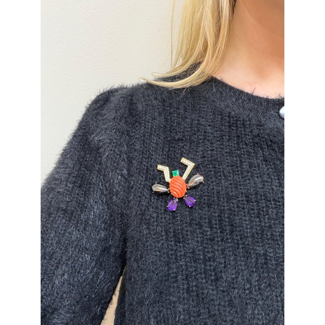 This whimsical brooch by designed by Paloma Picasso for Tiffany and Co. in a modern insect design is set with an oval...