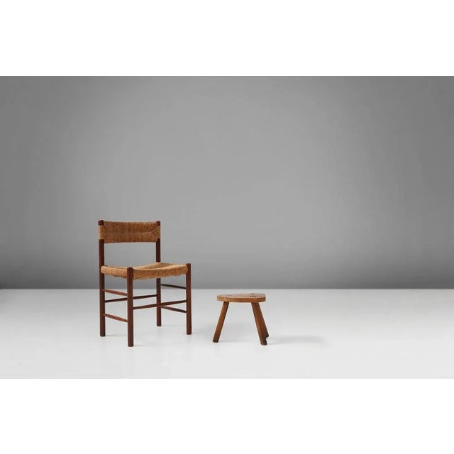 Rustic solid wooden stool. Made around 1920.