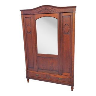 Antique Carved Oak Wardrobe Armoire With Mirror for Hanging Storage For Sale