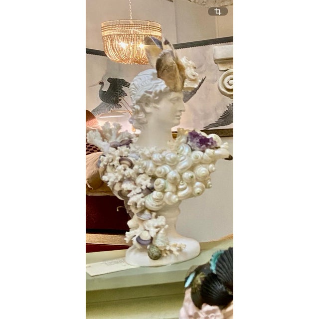 Shell and Amethyst-Encrusted Bust by May River Neptune. A singular sculptural bust, transformed into an evocative work of...