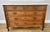 This elegant Antique French chest of drawers combines timeless craftsmanship with practical storage, making it an...