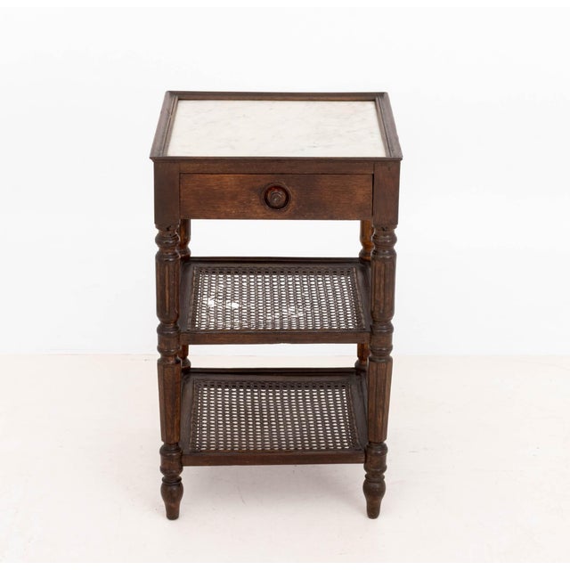Louis Philippe Cane-Paneled Oak Etagere, 19th century, with two tiers below a single drawer surmounted by a white...