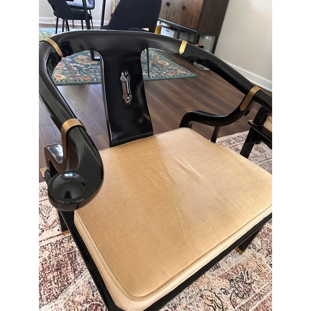 These vintage black lacquered set of Chinoiserie style chairs with brass accents are a beautiful addition to your home....