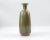 Vintage dipped stoneware vase by Robert Maxwell. Shades of olive green and brown drip/dip glaze over brown stoneware clay....