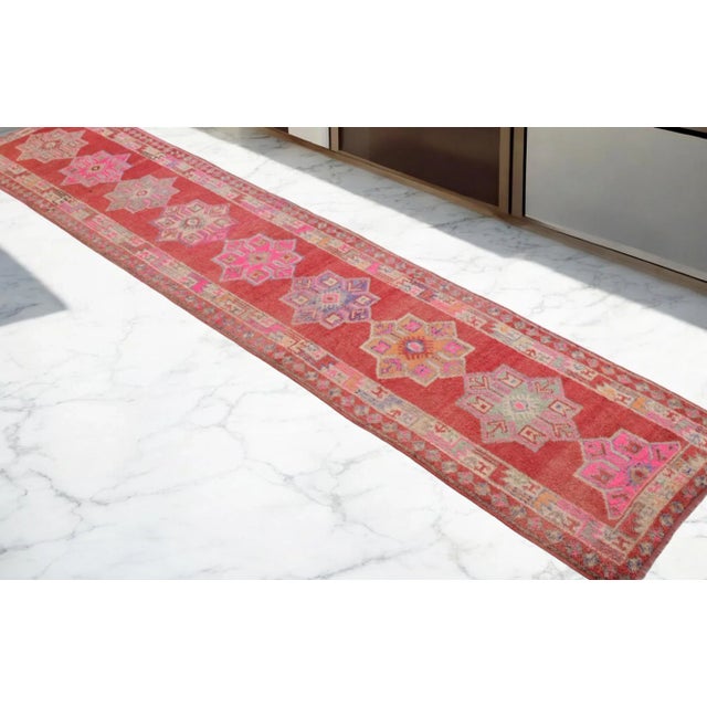 Offered is a muted color Hand knotted Kurdish runner rug, made in Anatolia approximately 40-50 years ago. The beautiful...