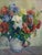 A lush spring bouquet bursts forth with a bounty of beautiful, vibrant flowers in bloom in this mid century floral still-...