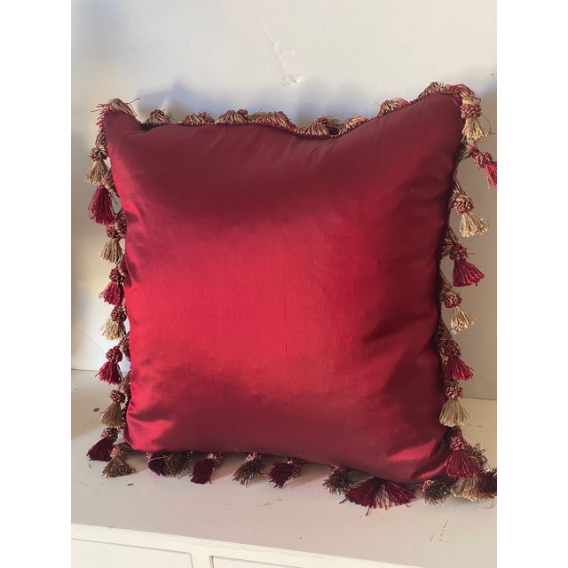 Splendid burgundy red silk pillow with floral embroidery and tassels. Feather down insert.