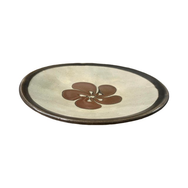 We have for your consideration a very beautiful studio pottery art flower plate or dish. not signed . Plate has very...
