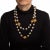 Vintage 70s Chanel faux pearl orb necklace crafted in yellow tone (circa 1971-1980). The necklace features faux pearls...
