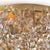 Delicately crafted crystal flowers suspended by gold frame, gives this flush mount a strikingly romantic feel. The hand-...