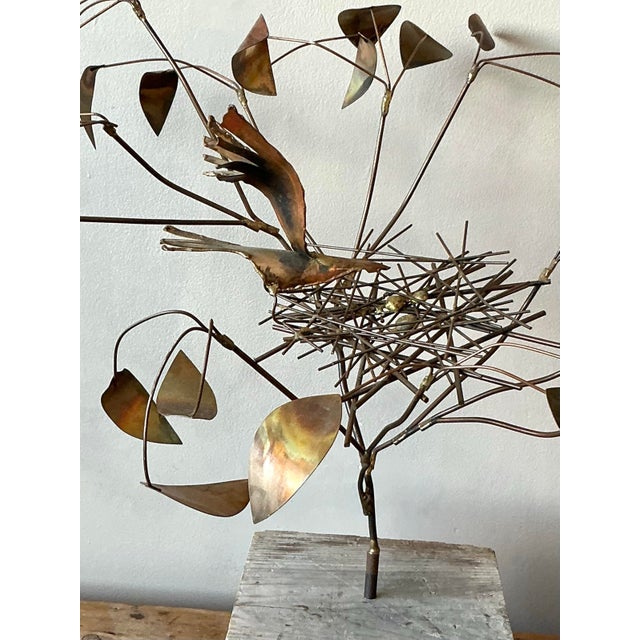 Evoke the natural beauty and artistic spirit of the mid-20th century with this captivating brass sculpture, reminiscent of...
