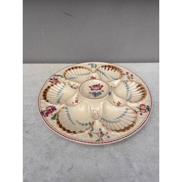 French Majolica oyster plate with flowers circa 1890 signed Longchamp.