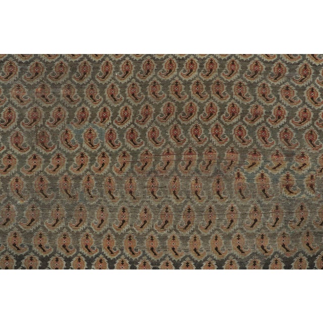 Hand-knotted in fine wool circa 1920-1929, this 6x10 antique Persian Malayer rug is an exquisite addition to Rug & Kilim’s...