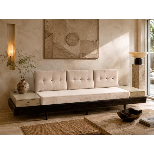 A custom-made convertible daybed sofa dating to the 1990s, thoughtfully designed with integrated side tables and a...