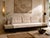 A custom-made convertible daybed sofa dating to the 1990s, thoughtfully designed with integrated side tables and a...