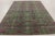 This 9x12 contemporary European-inspired rug, hand-knotted in wool and natural silk, celebrates richly ornamented floral...