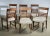 Six wooden chairs designed by Paolo Buffa, with a geometric decoration inlaid in the back, seat covered in fabric in the...