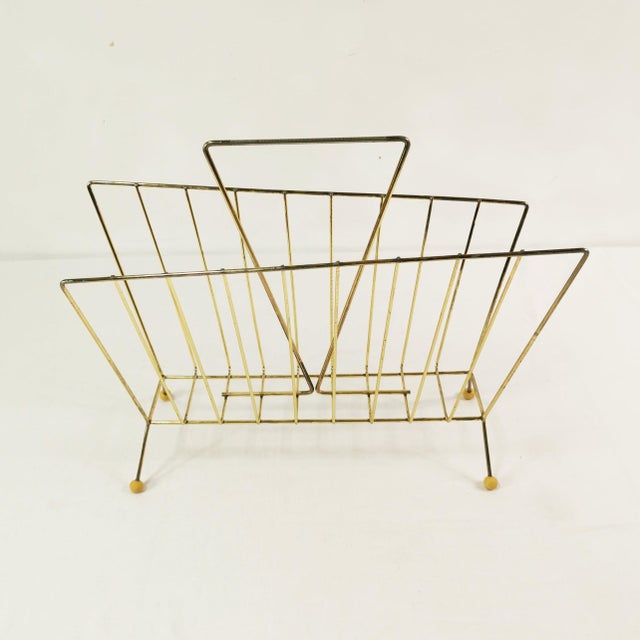 Newspaper stand from Germany, 1960s. It features a minimalist, spacious form, based on a modern design. Made of brass-...