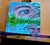 Contemporary I'll Be Your Mirror-Logan-7 Lakes, France by Amanda Seckington | Acrylic on panel Eye reflection in water with greenery. For Sale - Image 3 of 4