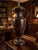 Elegant vintage Wildwood table lamp featuring a classic urn form in a rich dark mottled brown finish. Beautifully detailed...