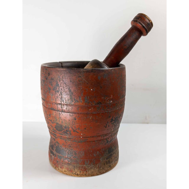 We are selling this great primitive antique Mortar and Pestle in red paint. This mortar has nice turned form with simple...