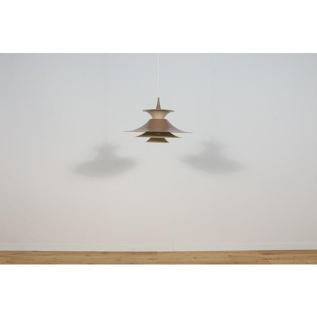 This is an impressive model Radius I pendant light. It was designed by Erik Balslev for Fog and Mørup in Denmark. The...