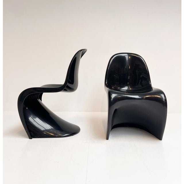 Timeless and iconic, the Panton Chair by Verner Panton for Vitra. This set consists of 2 vintage examples from the Herman...