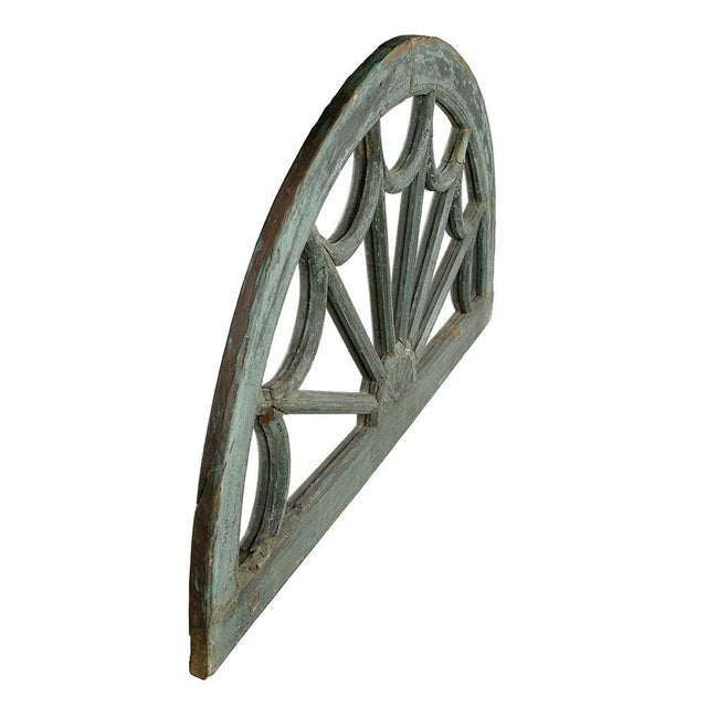 This charming antique half-moon shaped mirror is a unique piece that will bring a touch of elegance and character to your...