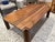 Our elegant joinery coffee table made from solid walnut. This durable piece highlights natural wood grain, serving as a...