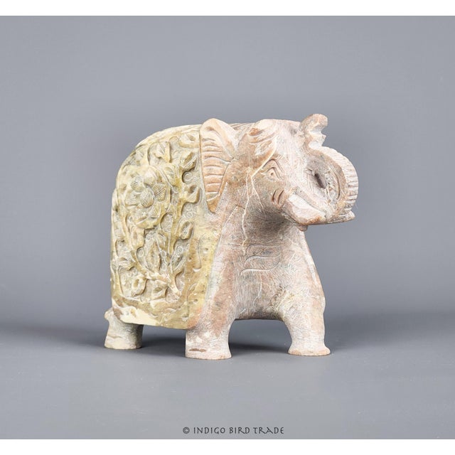 This exquisite vintage sculpture depicts an elephant, masterfully hand-carved from solid marble stone. Crafted from a...