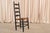 A set of six antique American Shaker ladder back dining chairs with hand-woven rush seats, a classic of American folk...