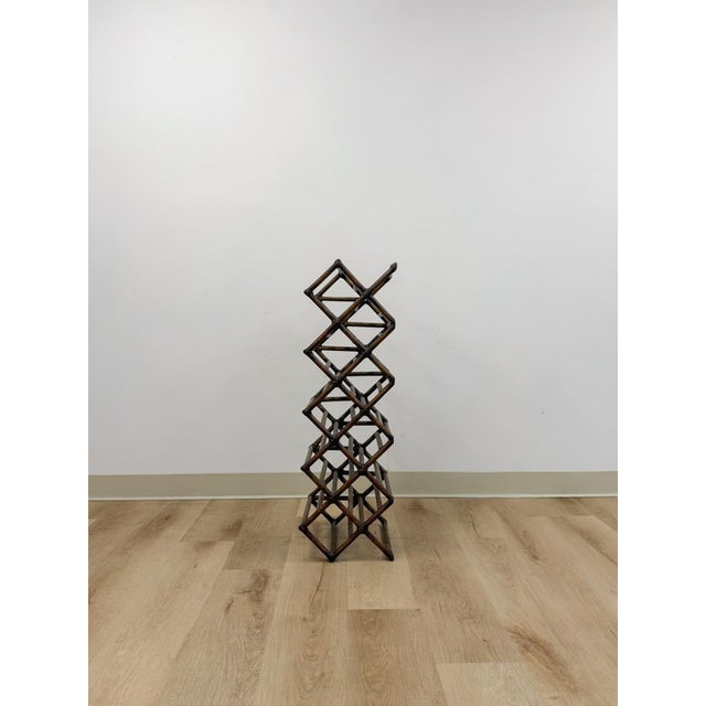 This handsome vintage dark bamboo 12-bottle wine rack is a practical and decorative coastal and boho bar accent find. The...