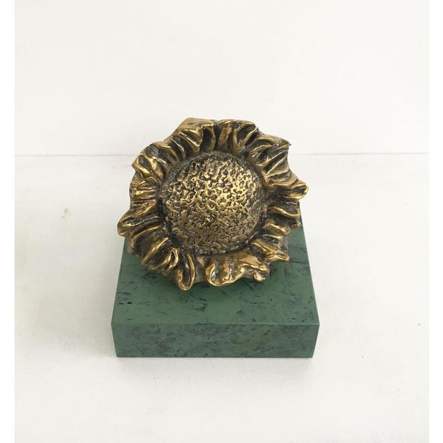 This is an engaging bronze sculpture created by the Italian artist Patrizia Guerresi, in 1986. The piece is a multiple of...