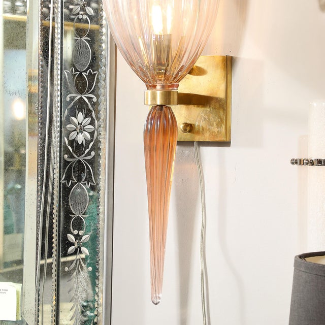 This elegant and beautifully scaled Pair of Modernist Iridescent Pink Hand-Blown Murano Glass Fluted Sconces W/Spike Drop...