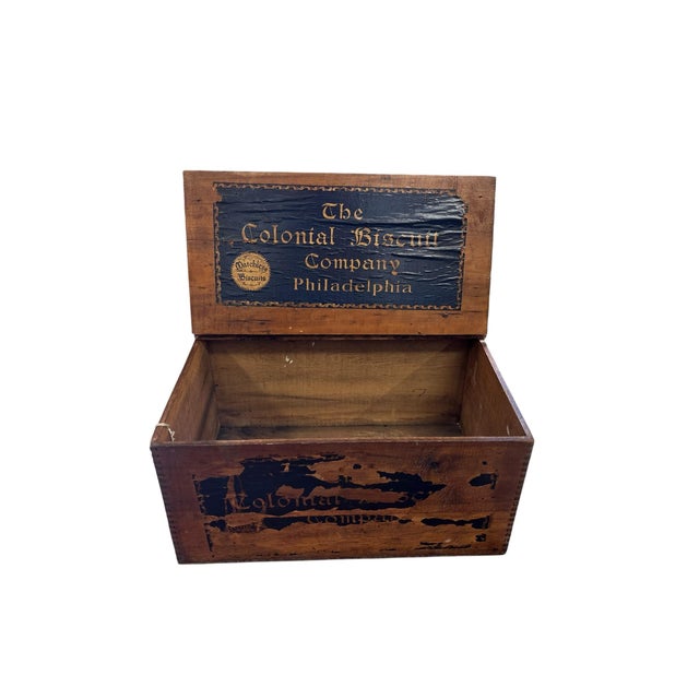 A wonderfully authentic antique wooden shipping crate from The Colonial Biscuit Company of Philadelphia, retaining...
