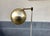 Unusual Scandinavian floor lamp with an adjustable spherical shade in brass. Anonymous maker/design in the style of Verner...