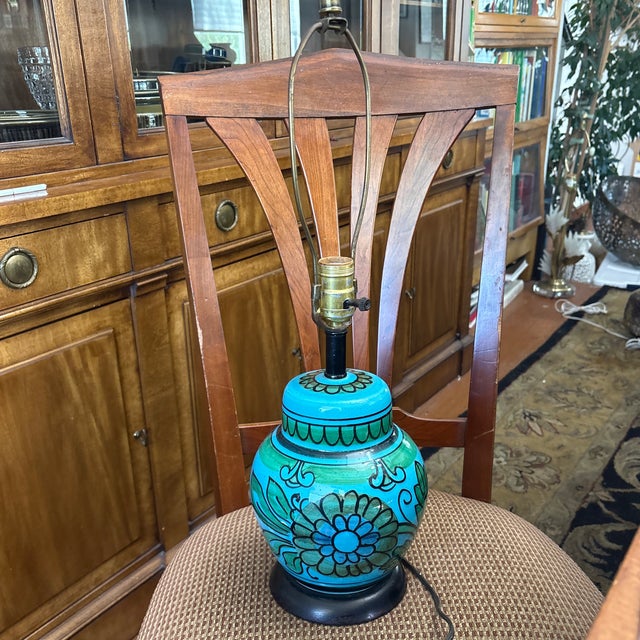 This vibrant ceramic lamp is a notable piece of Italian mid-century modern art pottery. Specifically, it is a vintage...