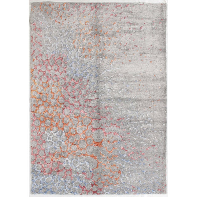 Hand-knotted modern rug featuring a dynamic abstract composition with organic, cell-like patterns flowing across a soft...