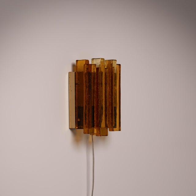 A refined piece of Danish mid-century, a wall lamp designed by Svend Aage Holm Sørensen for his own company, Holm Sørensen...