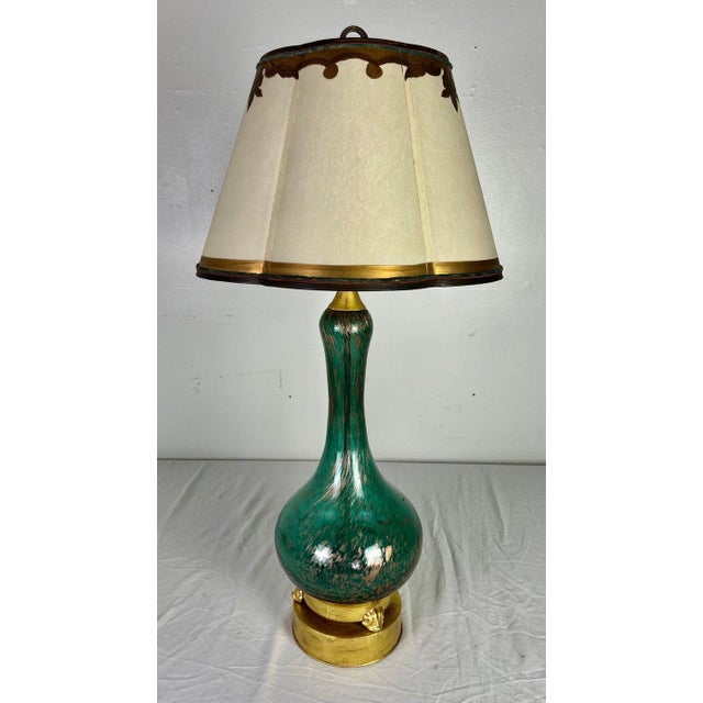 20th Century Italian Murano lamp with custom parchment shade. The lamp is a rich shade of teal blue with gold flecks and...