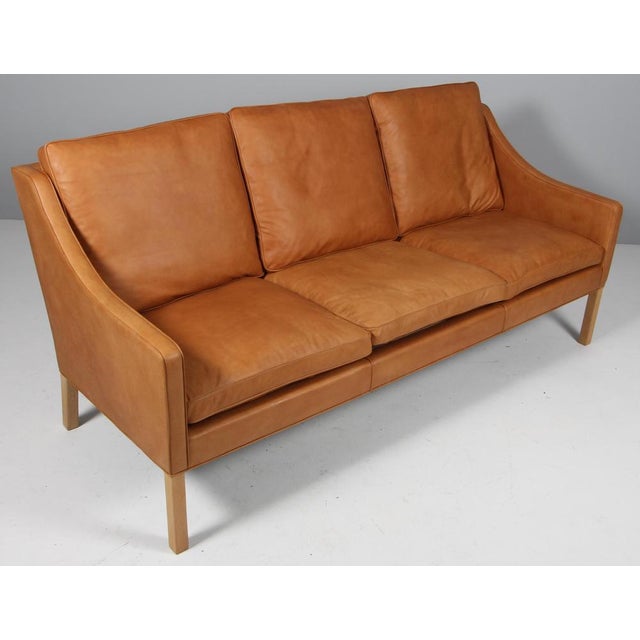 Børge Mogensen three-seat sofa new upholstery with cognac vintage full grain aniline leather. Legs of oak. Model 2209,...