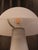 Elegant vintage Italian lamp from the 1970s, crafted from white Murano-style glass. Its organic and minimalist design adds...