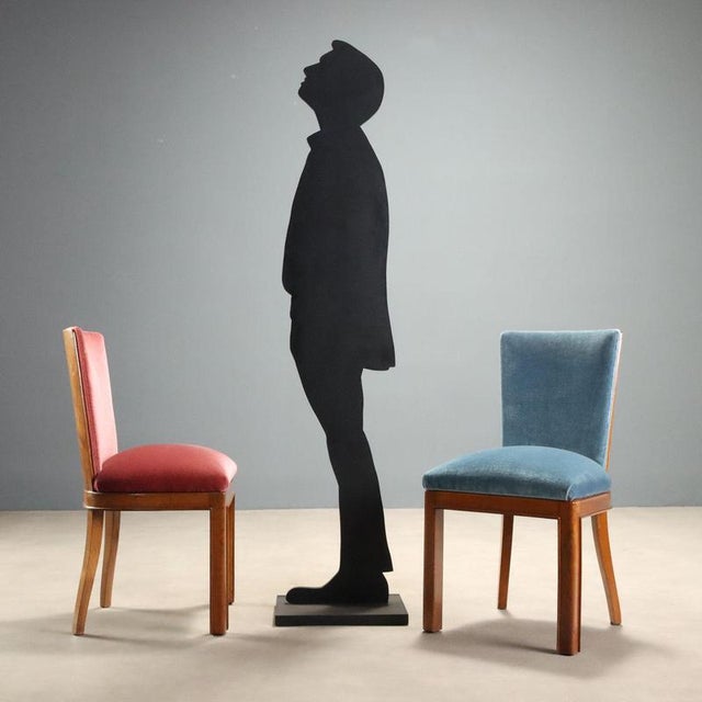 Set of six 1950s chairs made of stained beech wood, with a walnut veneered backrest that imparts timeless elegance. The...